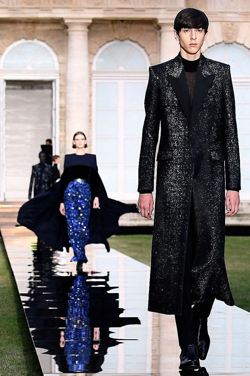 The haute couture show by Givenchy (above and below) was held in the gardens of the National Archives in Paris' Marais district.