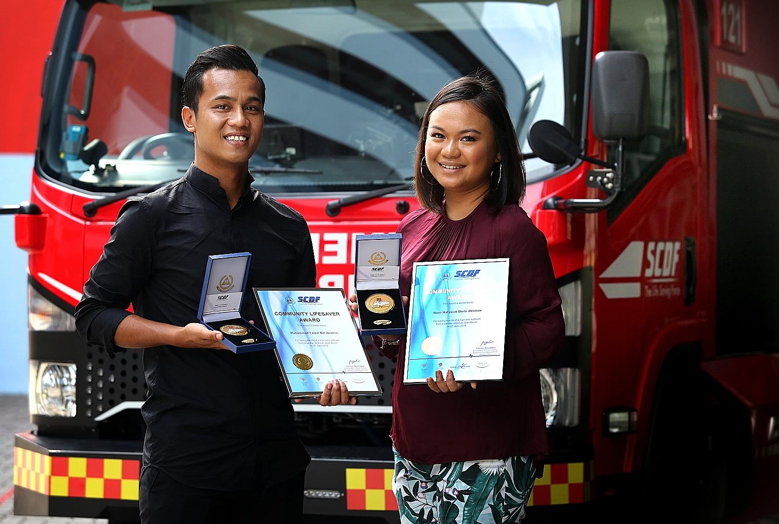 Mr Muhammad Faizal Ibrahim and his girlfriend Noor Hafawati Othman with their Community Lifesaver Awards from SCDF, given in recognition of their public spiritedness.