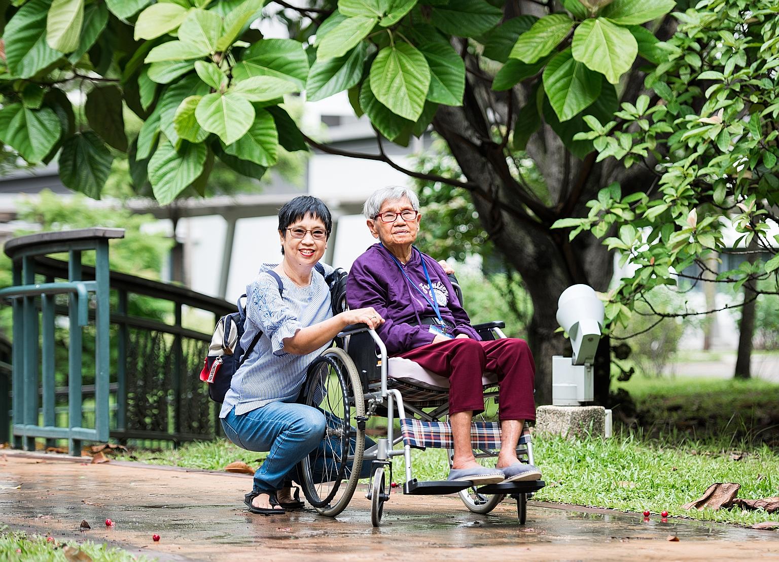 The Medisave move will help Madam Quek Pong, seen here with her daughter Sarah Liew. Madam Quek gets $300 a month from ElderShield now, but her children have to pay the rest of her expenses - about $900 a month.