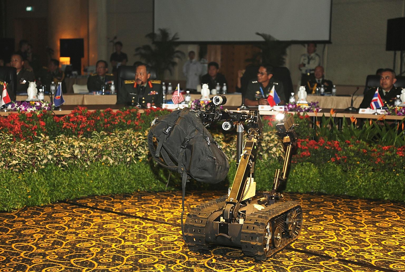 A Talon Unmanned Ground Vehicle removing a suspicious bag during a demonstration by the SAF's CBRE Defence Group at the workshop.