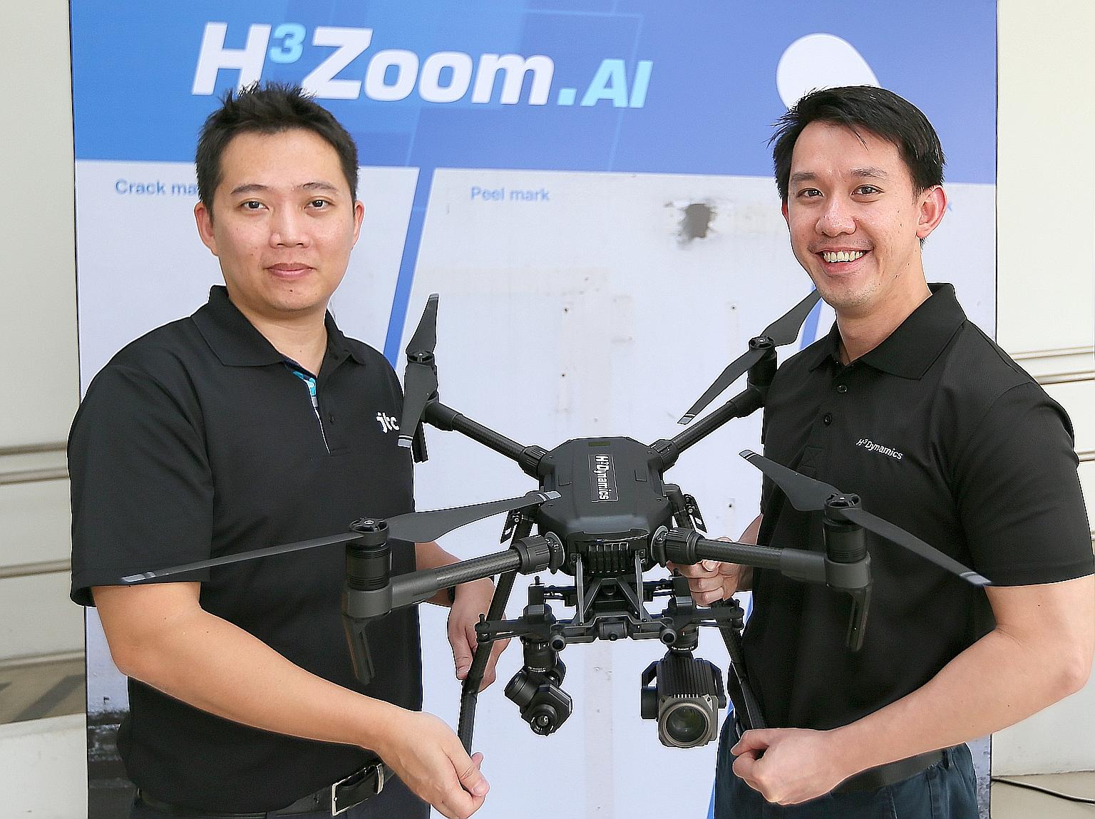 JTC director of building management Jason Foo (left) and H3 Zoom.AI chief technical officer and co-founder Shaun Koo with the H3 Zoom.AI Facade Inspector. Mr Foo said the ease of using the system will encourage building owners to check facades more f