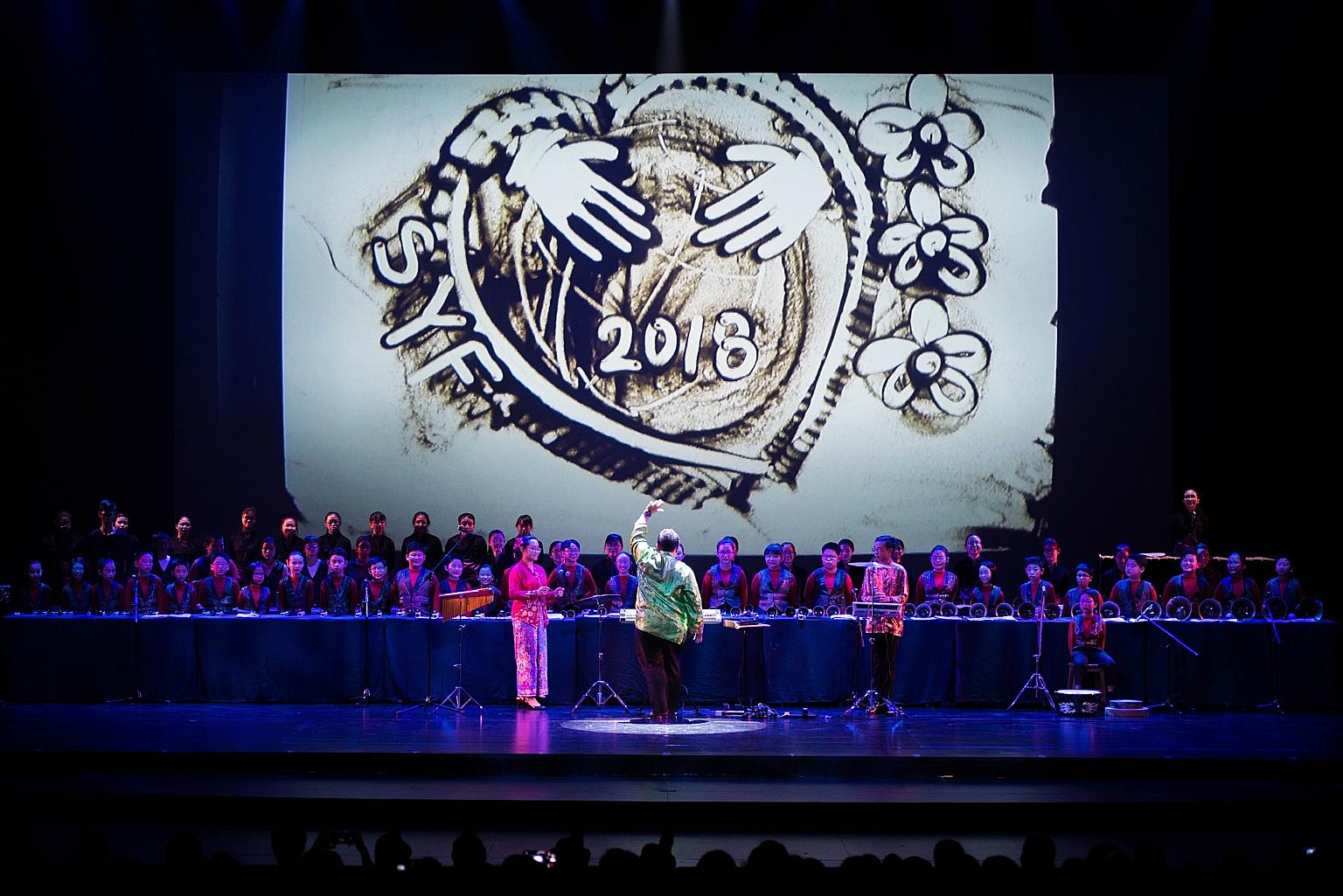 The Singapore Youth Festival concert on June 30 opened with a performance of sand art by Zhonghua Secondary students, with a musical backdrop with handbells performed by students with special needs from Grace Orchard School, and their peers from Guan