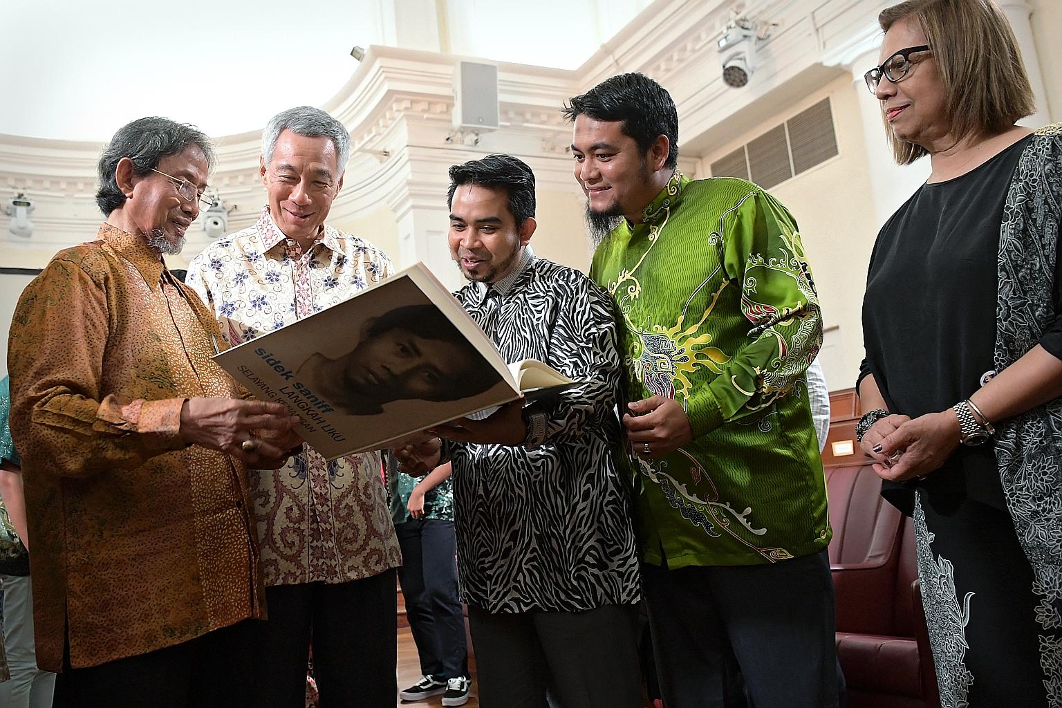(From left) Former senior minister of state Sidek Saniff, Prime Minister Lee Hsien Loong, member of Universiti Pendidikan Sultan Idris' (UPSI) board of directors Sani Araby Dato' Abdul Alim Araby, and UPSI Alumni Centre director Mohd Izwan Shahril, w