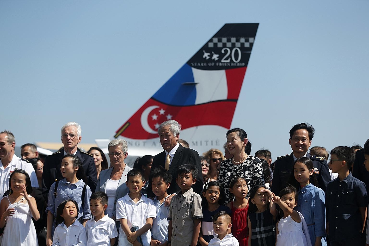 Defence Minister Ng Eng Hen and his wife with France's Secretary of State to the Minister for the Armed Forces Genevieve Darrieussecq (on Dr Ng's right) and Singapore's Chief of Air Force Mervyn Tan (right) with family members of 150 Squadron at Caza
