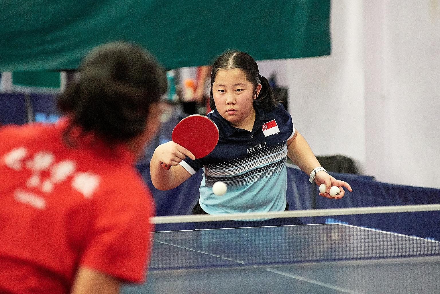 Lim Qi, who is ranked 11th in her age group, at a practice session at the Singapore Table Tennis Association. The 12-year-old excels not only in table tennis but also in her studies.