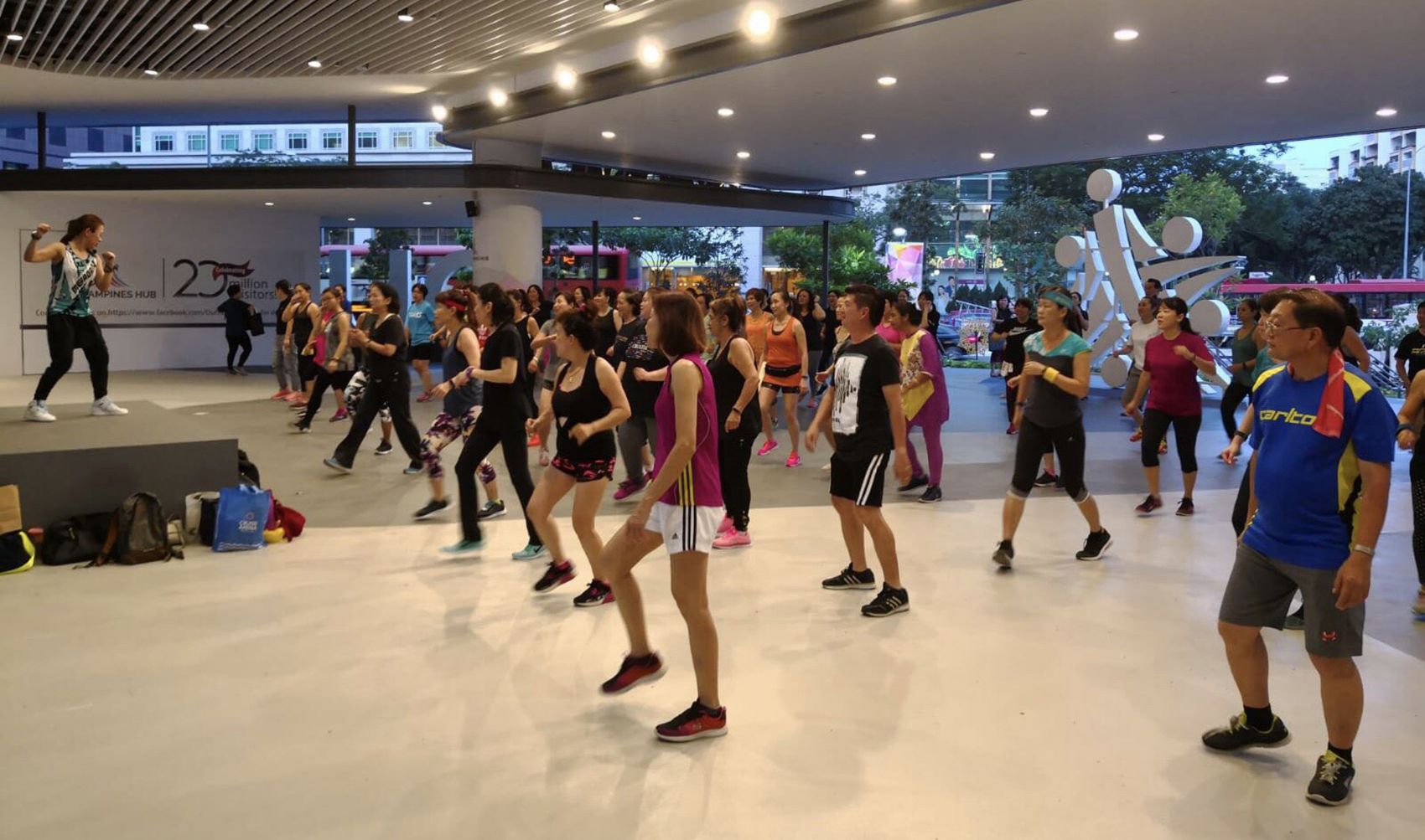 A Megadanz session being led by fitness instructor Heidi Lim at Gate 1 of Our Tampines Hub. This session, co-organised by People’s Association, Our Tampines Hub and Alpha Fitness, takes place every Friday from 7pm to 8pm and is free.