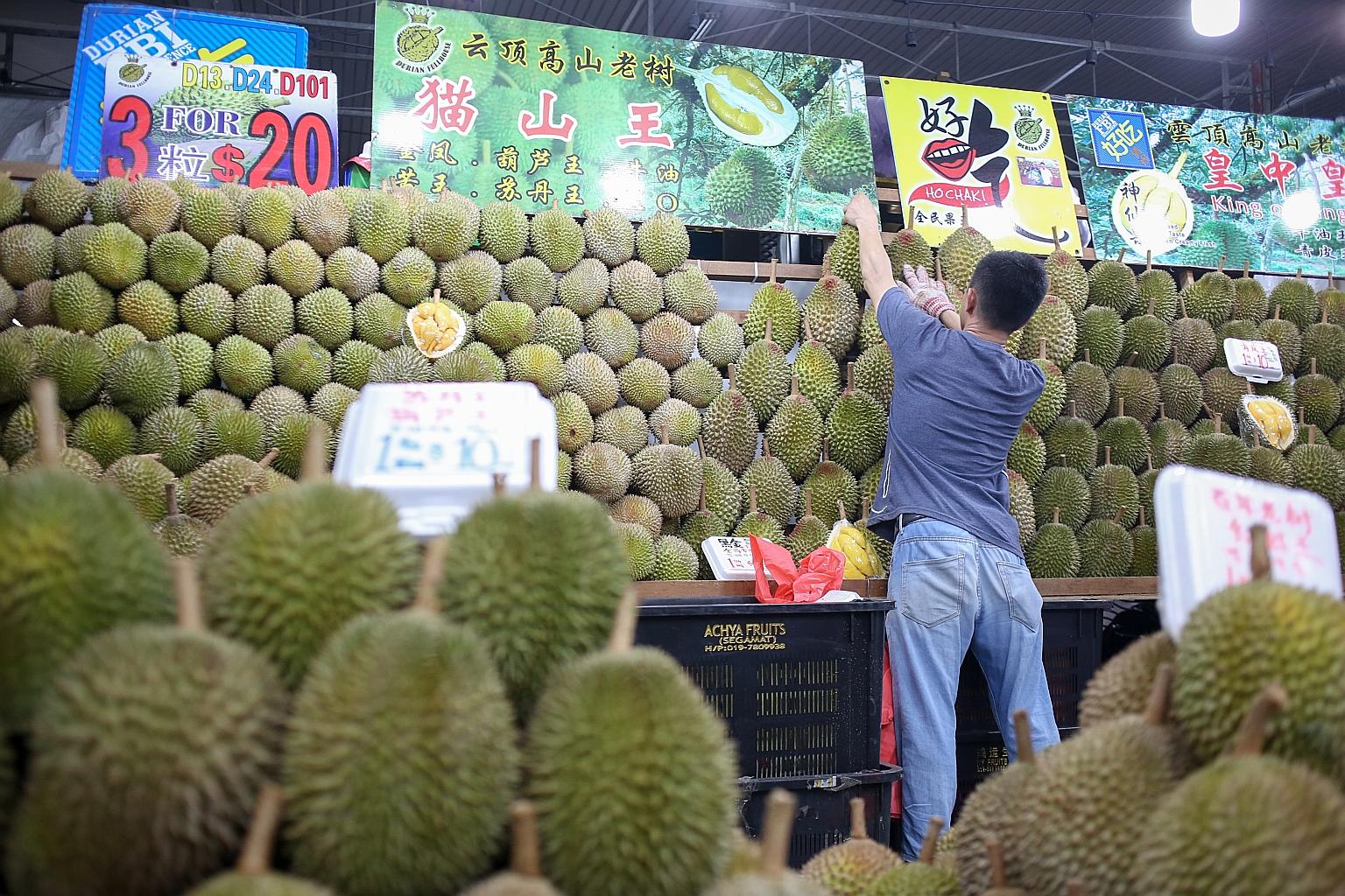 Durians on sale at Durian FullHouse, near Kovan market and food centre. Thanks to good weather in Malaysia, there is a bumper crop of durians.
