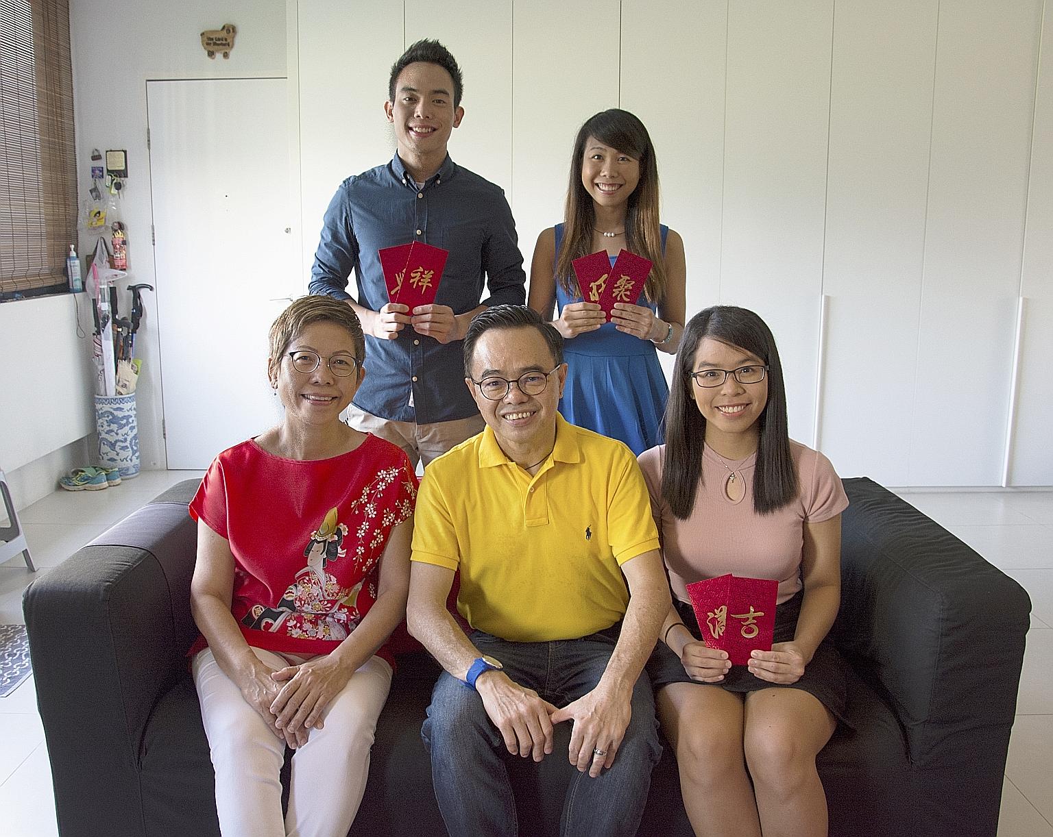 Mr and Mrs Foong with (from left) Ivfeno, Ivfen and Ivfy during Chinese New Year last year. The three siblings knew how they were conceived when they were young. "We were featured in an article in The Straits Times (when we were) in primary school an