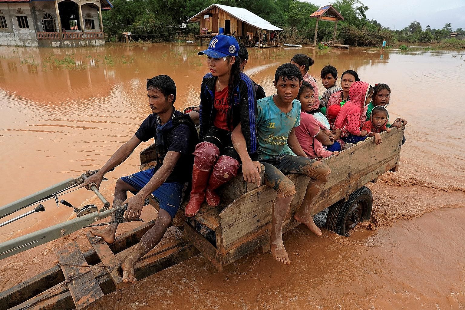 A family escaping the floods in Attapeu province, Laos.