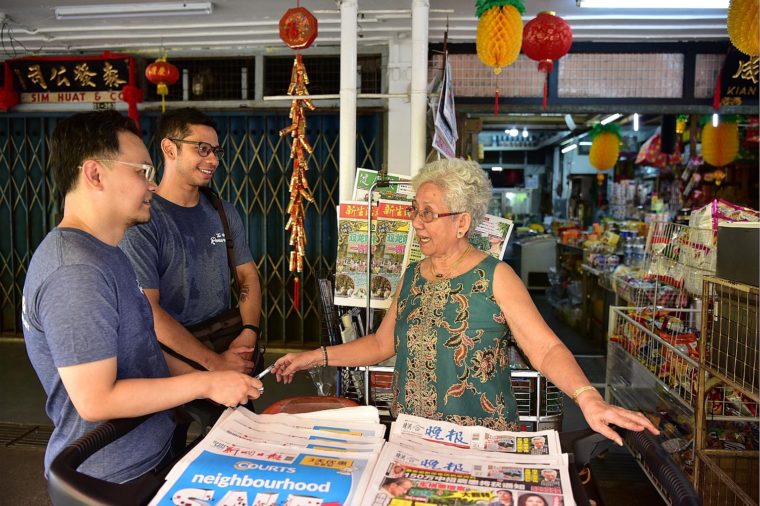 Volunteers Loh Kah Seng and Joseph Nair interviewing Madam Lim Ang Ah, 79, from Kian Seng provision shop in Tanglin Halt. Dr Loh and Mr Nair are part of a team of volunteers from civic group My Community working on a cultural project that aims to pie