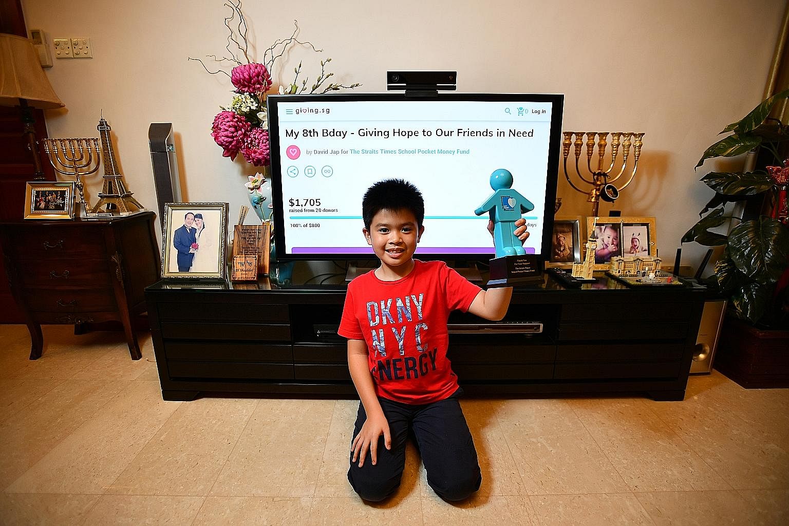 Primary 2 student David Jap, seen here at home, set up a crowdfunding page on Giving.sg to raise funds for the Straits Times School Pocket Money Fund, which has raised more than $1,700. Crowdfunding has taken off here in a big way in the past few yea