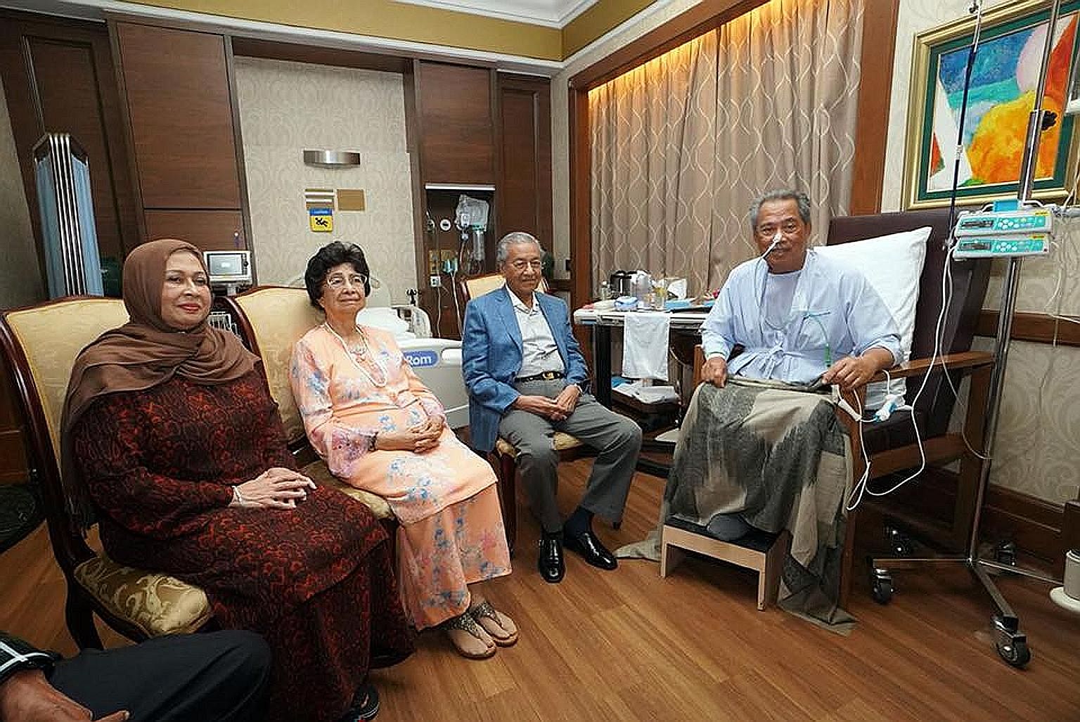 Malaysian Home Affairs Minister Muhyiddin Yassin, who is warded in a Singapore hospital, received a visit from Malaysian Prime Minister Mahathir Mohamad and his wife, Tun Siti Hasmah Mohamad Ali. With them is Tan Sri Muhyiddin's wife, Puan Sri Noorai