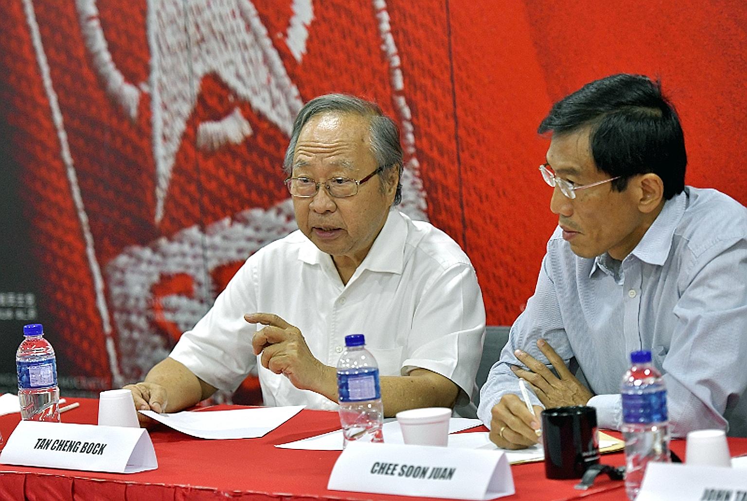 Former PAP MP Tan Cheng Bock (left) and SDP chief Chee Soon Juan at Saturday's meeting. Efforts to form an alliance had been ongoing without success, but the Malaysian election result was a turning point, said opposition leaders.