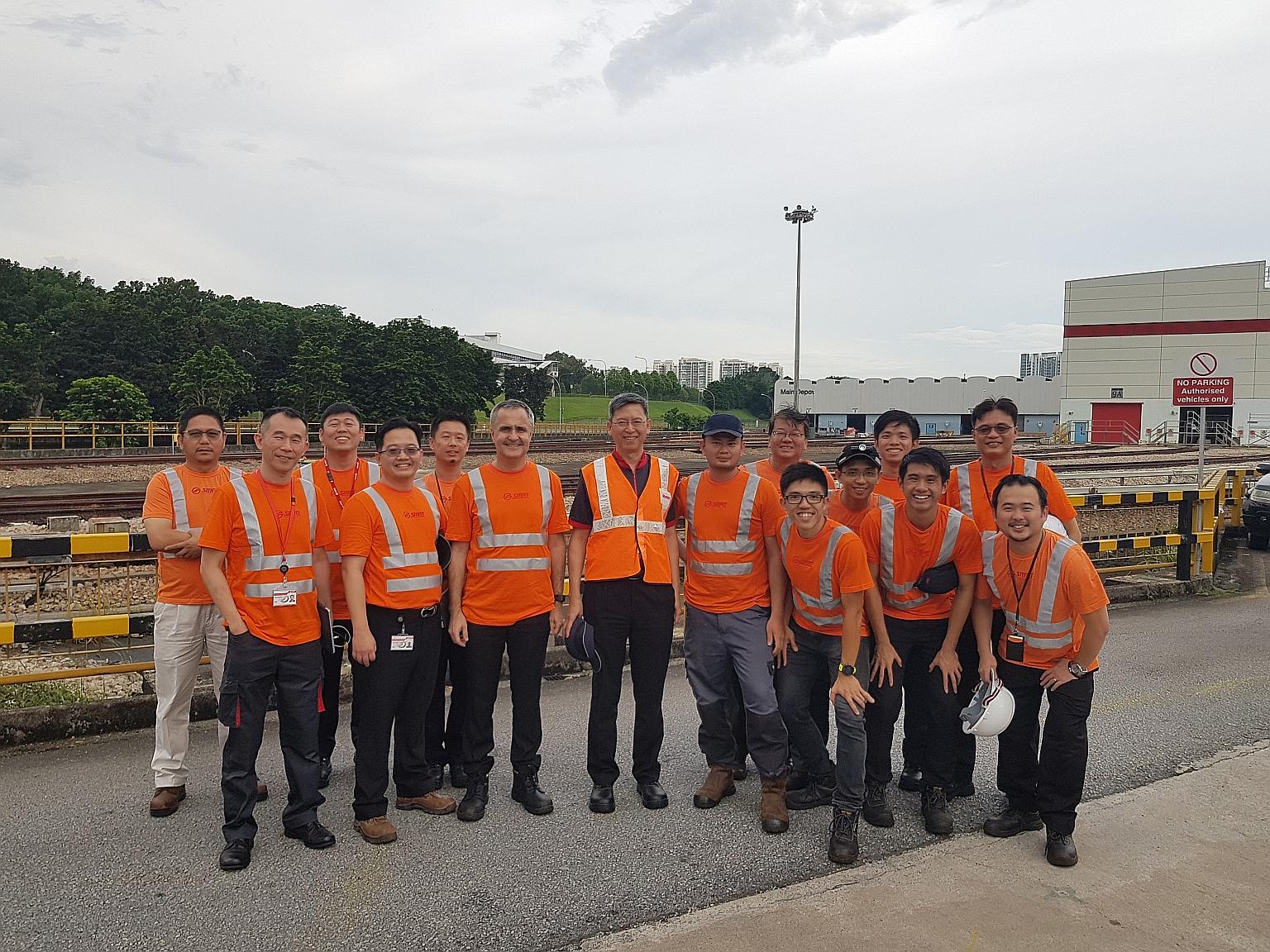 Mr Neo Kian Hong (centre), who took over as chief executive of SMRT yesterday, with engineers from the Permanent Way team, which looks after track and trackside infrastructure, at Bishan Depot during a familiarisation visit in May.