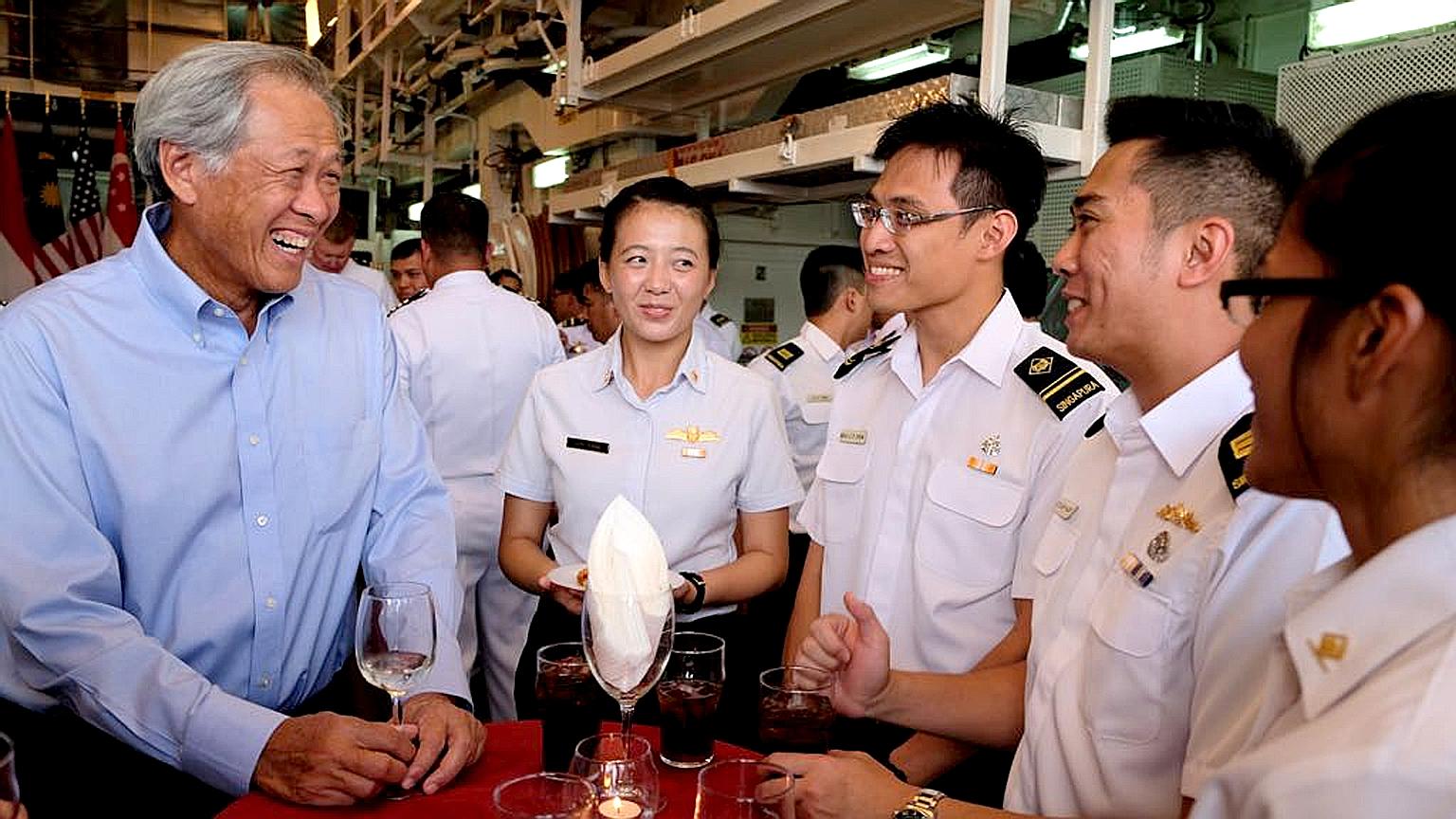 Defence Minister Ng Eng Hen interacting with personnel from the Republic of Singapore Navy who are participating in Exercise Rimpac. The biennial warfare exercise - from June 28 to Aug 3 - involves 25,000 personnel, 45 ships, five submarines and abou