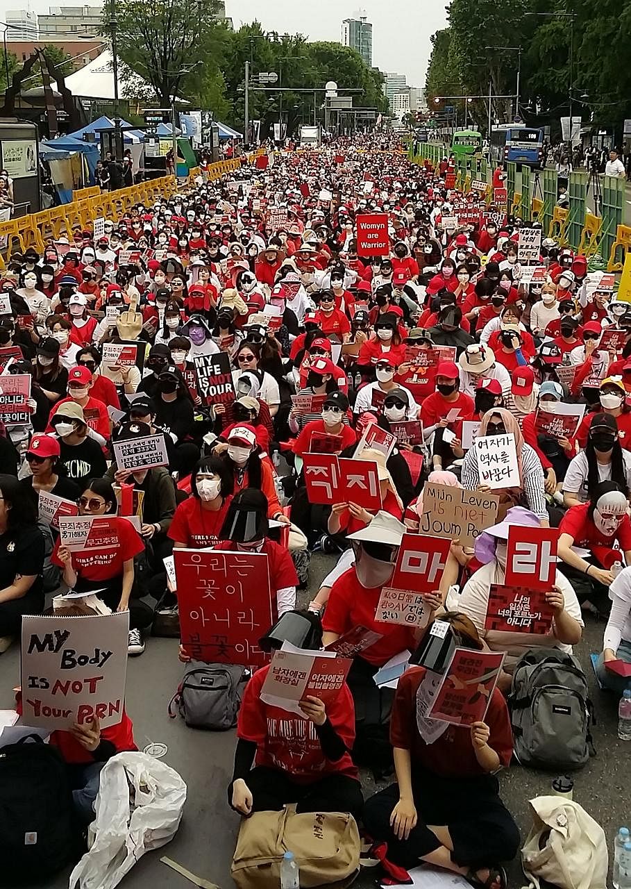 South Korean women staging a monthly protest in June against spy cam crimes. Among the offenders were teachers, church pastors, government officials, police officers and a court judge.