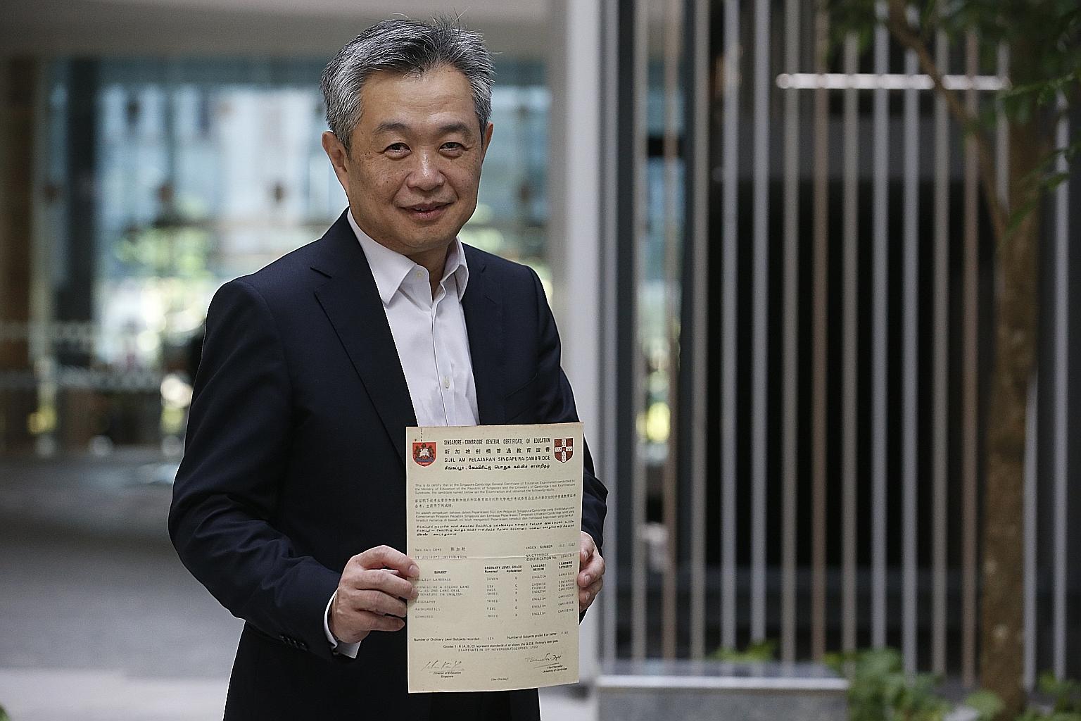 Mr Tan Kah Chye with his GCE O-level results. The "late developer" eventually became one of the top bankers in the world.