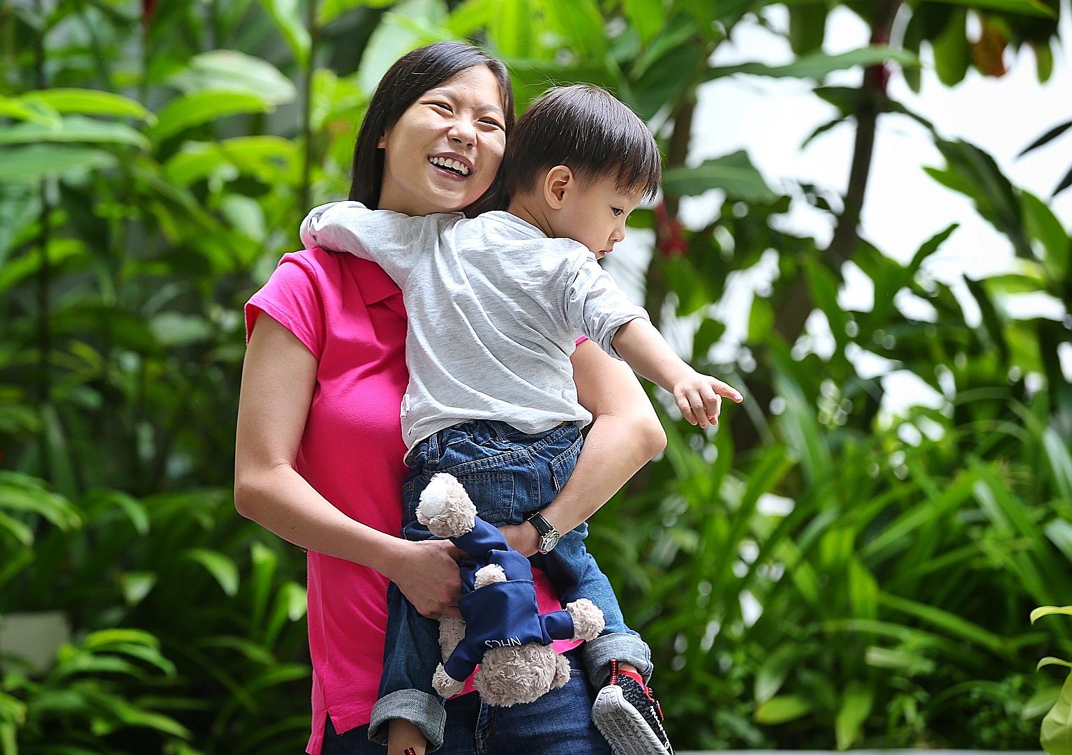 Ms Winnie Tan, 31, with her son Winson, two. She benefited from SGH's joint clinic scheme when she was expecting her first child three years ago. Ms Tan, who was born with two holes in her heart, had a difficult pregnancy. Supervision by doctors from