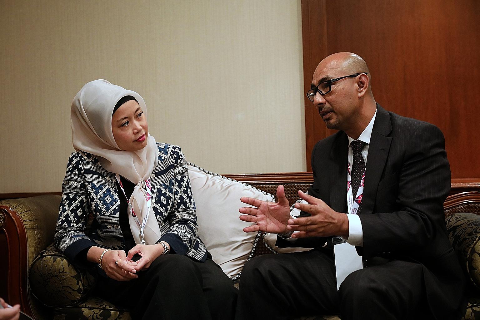 Ms Adelina Kamal, executive director of the Asean Coordinating Centre for Humanitarian Assistance, and Mr Said Faisal, her predecessor, meeting on the sidelines of the annual Asean Strategic Policy Dialogue on Disaster Management yesterday.