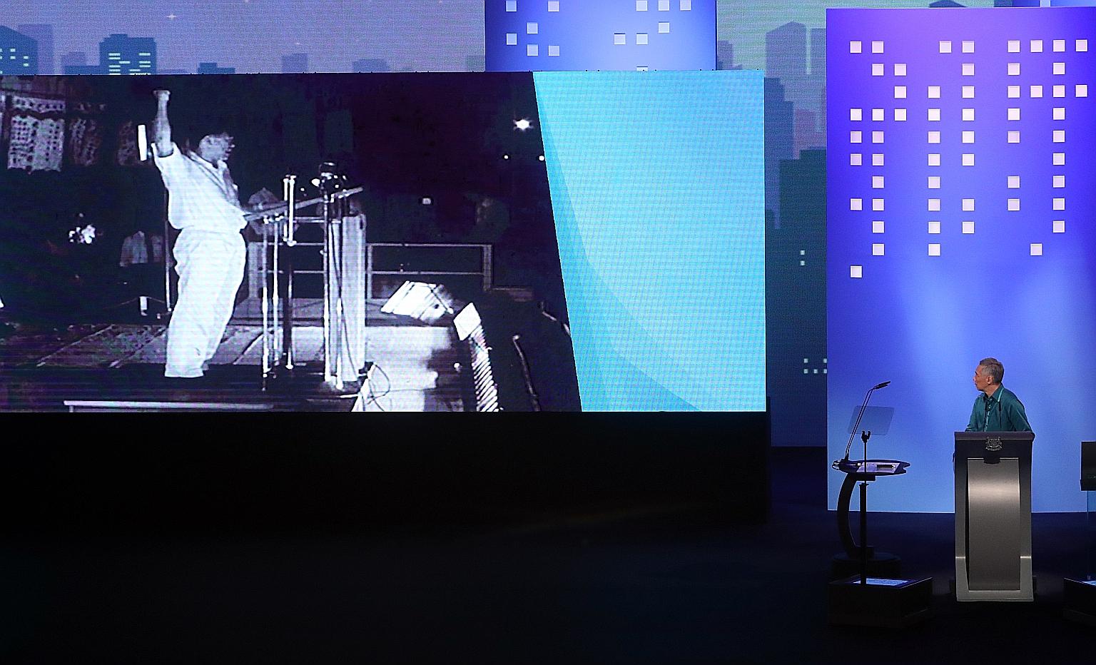 Prime Minister Lee Hsien Loong on stage at the National Day Rally yesterday, as a video clip was played showing newly elected Prime Minister Lee Kuan Yew speaking at the Padang on June 3, 1959.