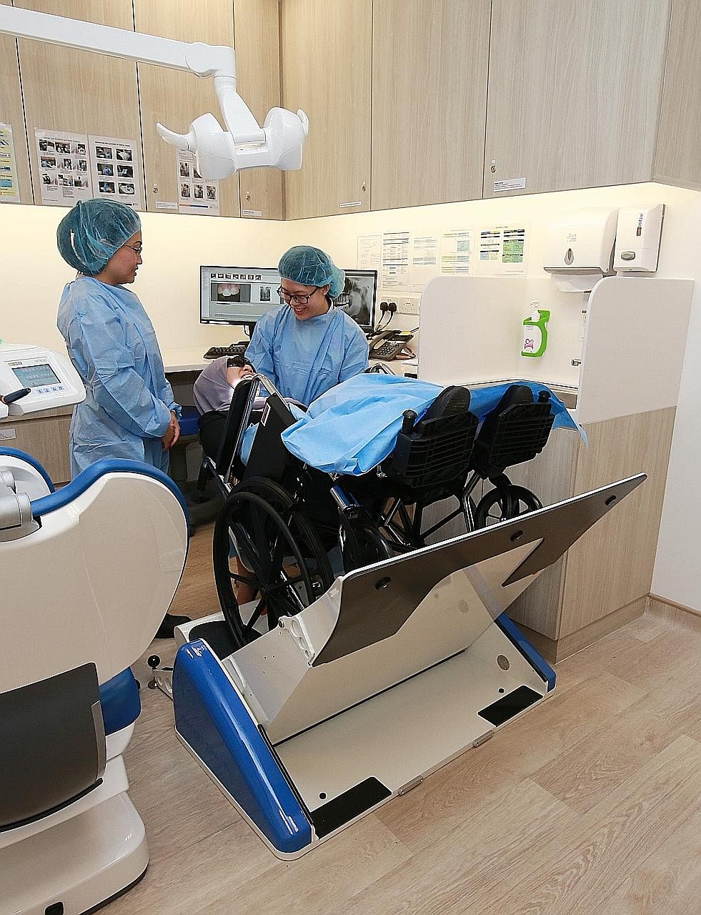 A wheelchair tilter that helps patients in need of dental care at Ang Mo Kio Polyclinic. Many polyclinics, like the one in Ang Mo Kio which officially reopened in June, are being refurbished to meet the needs of the ageing population.