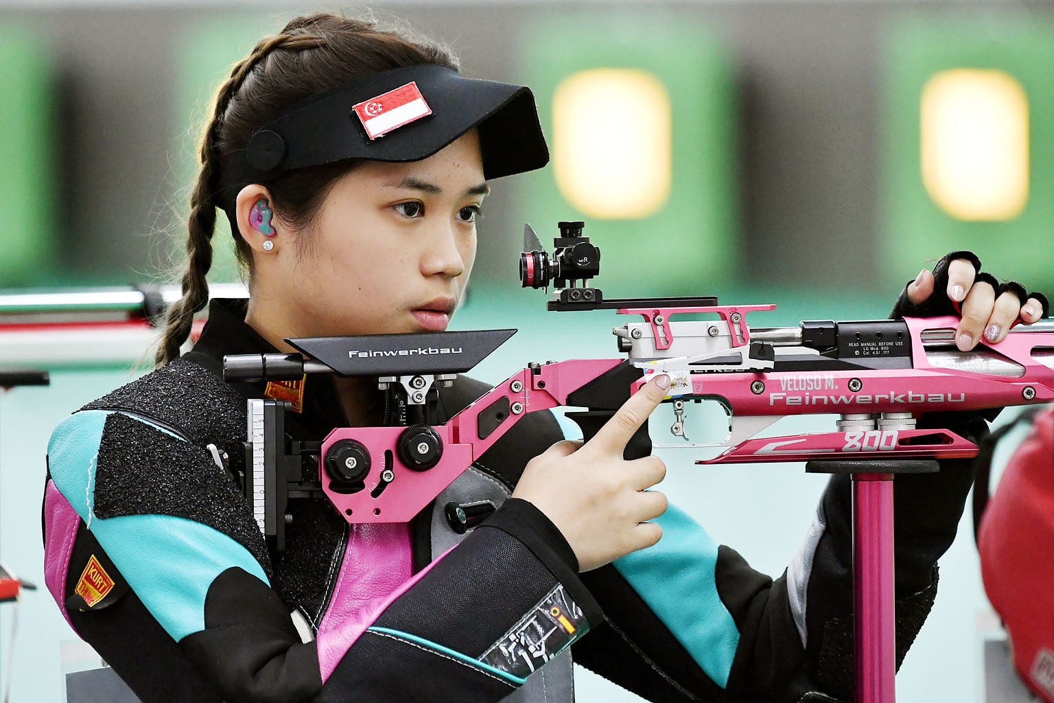 Martina Veloso, 18, during the women's 10m air rifle qualification at the Jakabaring International Shooting Range. She finished sixth out of eight finalists with a score of 164.