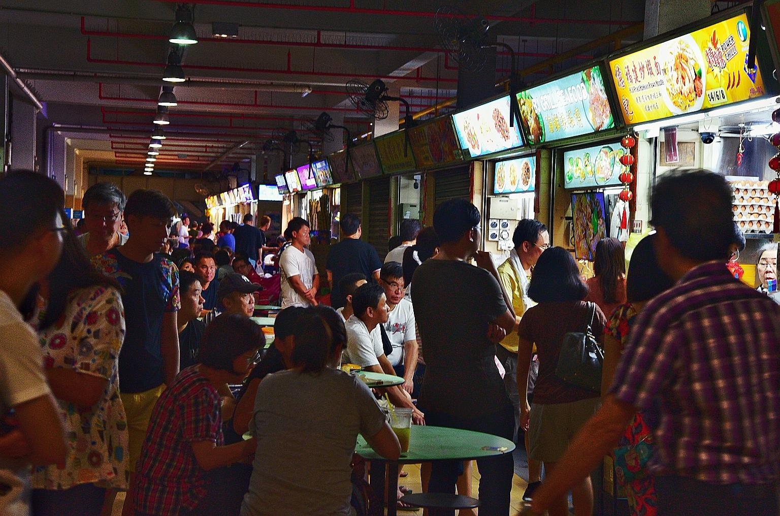 Patrons at Old Airport Road Food Centre. One of the key challenges, say experts, is to attract younger hawkers who will stay on in the business. They hope the Unesco nomination will spur the authorities here to pour more resources into making the tra