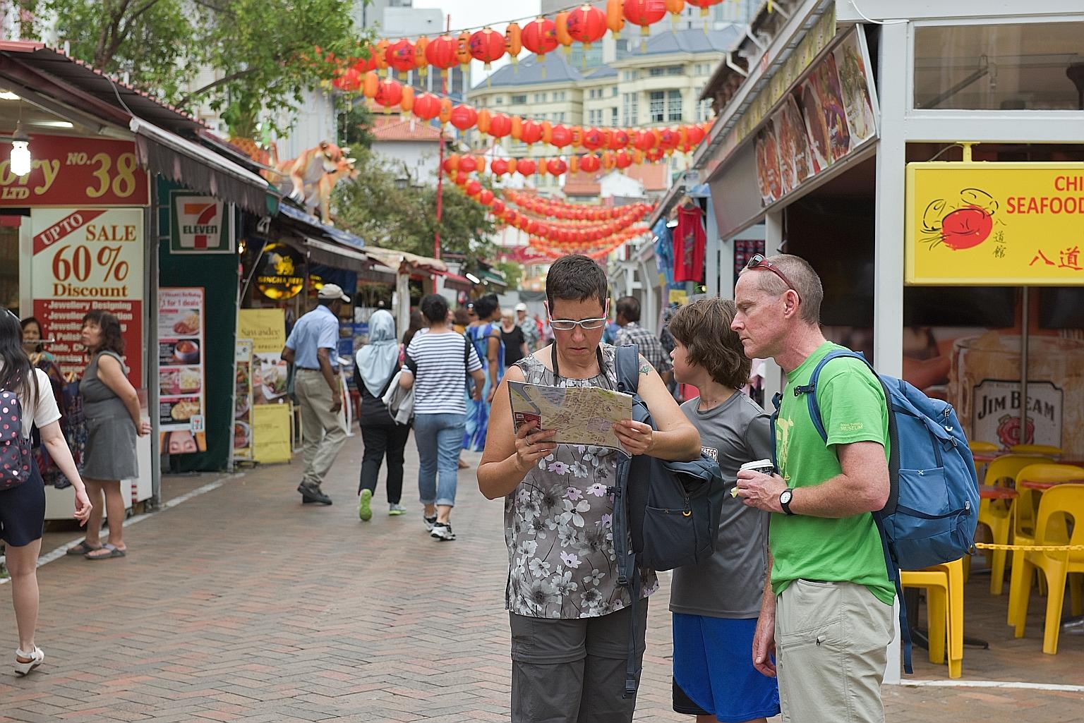 Tourists in Chinatown. Some 4.6 million visitors arrived in Singapore in the first quarter, but tourist spending dipped to $6.7 billion because of less spending in areas such as shopping and accommodation.