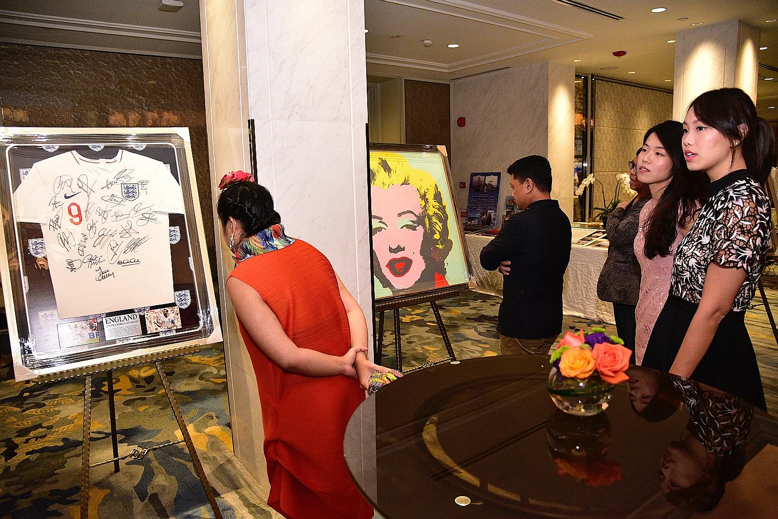 Aware supporters looking at items up for silent bidding as part of efforts to raise funds for the #MeToo Action Fund launched yesterday.