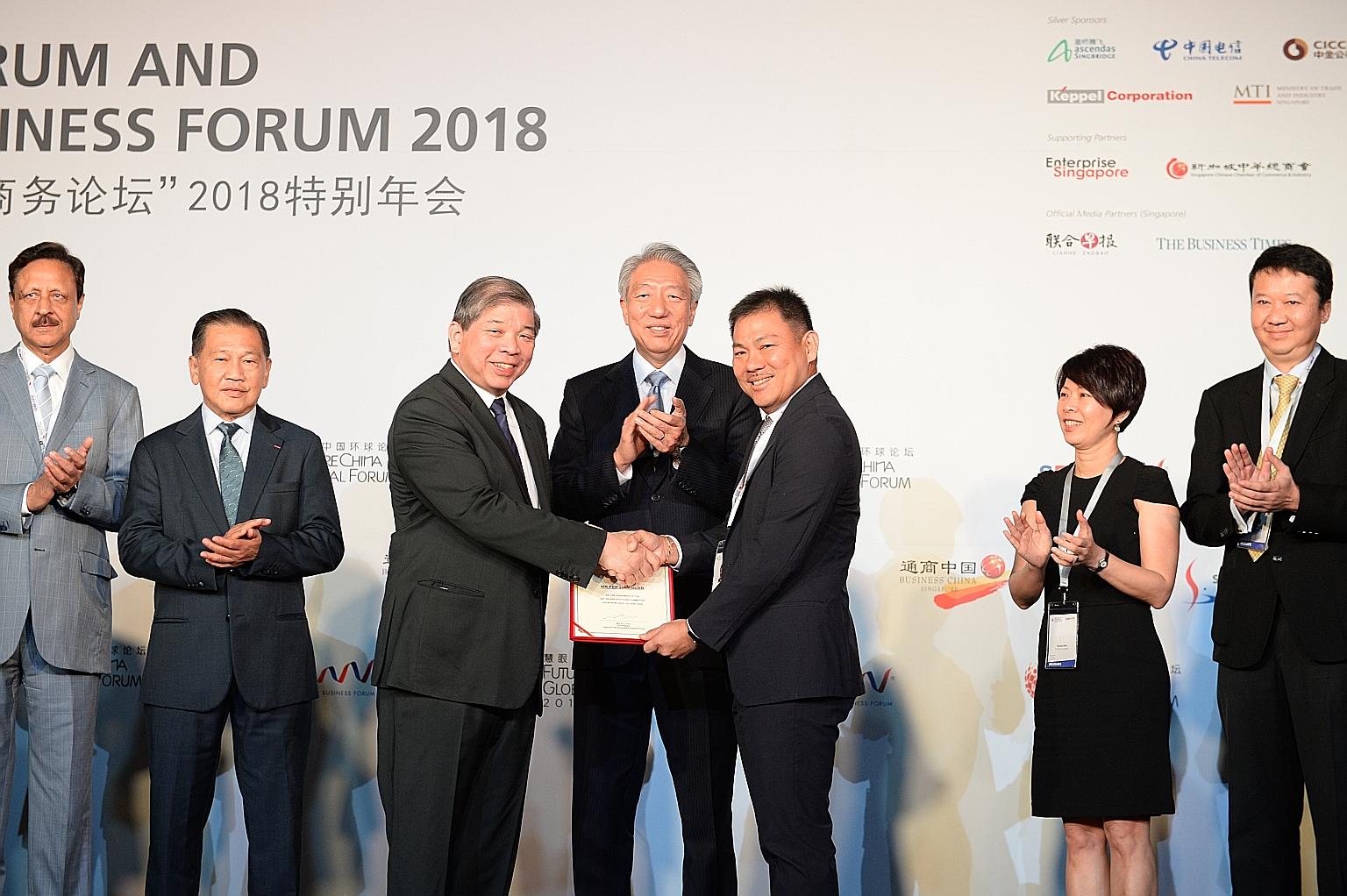 Deputy Prime Minister Teo Chee Hean (centre) witnessing the launch of the Singapore Business Federation's (SBF) new Infrastructure Committee yesterday with SBF chairman S.S. Teo (far left) and SBF vice-chairman Pek Lian Guan.