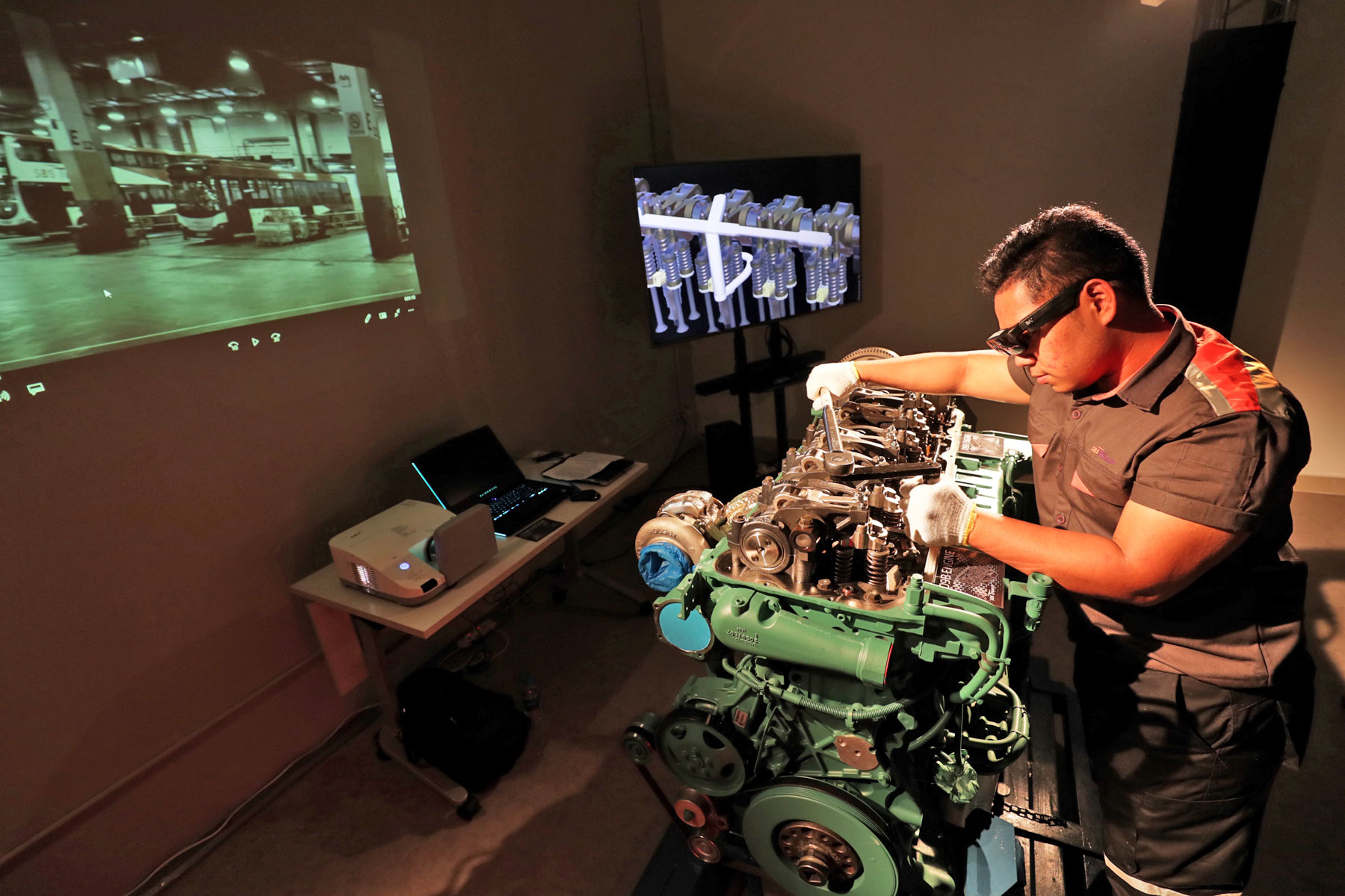 Technicians at the new Bus Technical Specialist Certification Centre, located at the Ulu Pandan Bus Depot, use augmented reality glasses as part of their training.