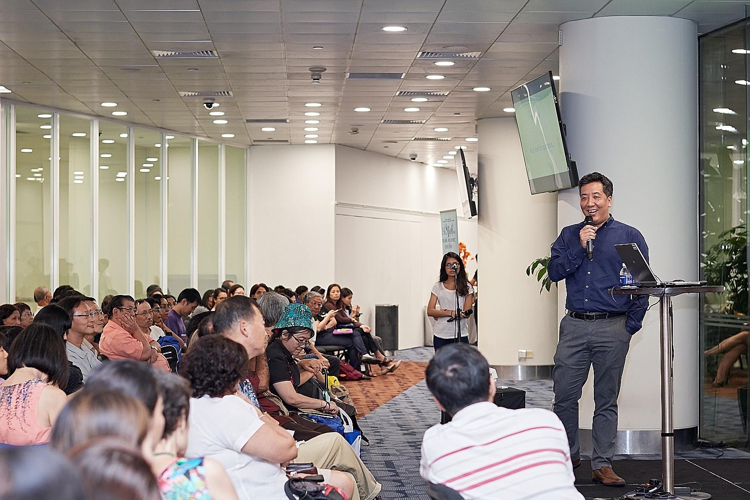 Straits Times news editor Marc Lim addressing some 200 people at the askST@NLB talk yesterday. He also tackled topics such as fake news and maintaining a newspaper's credibility.