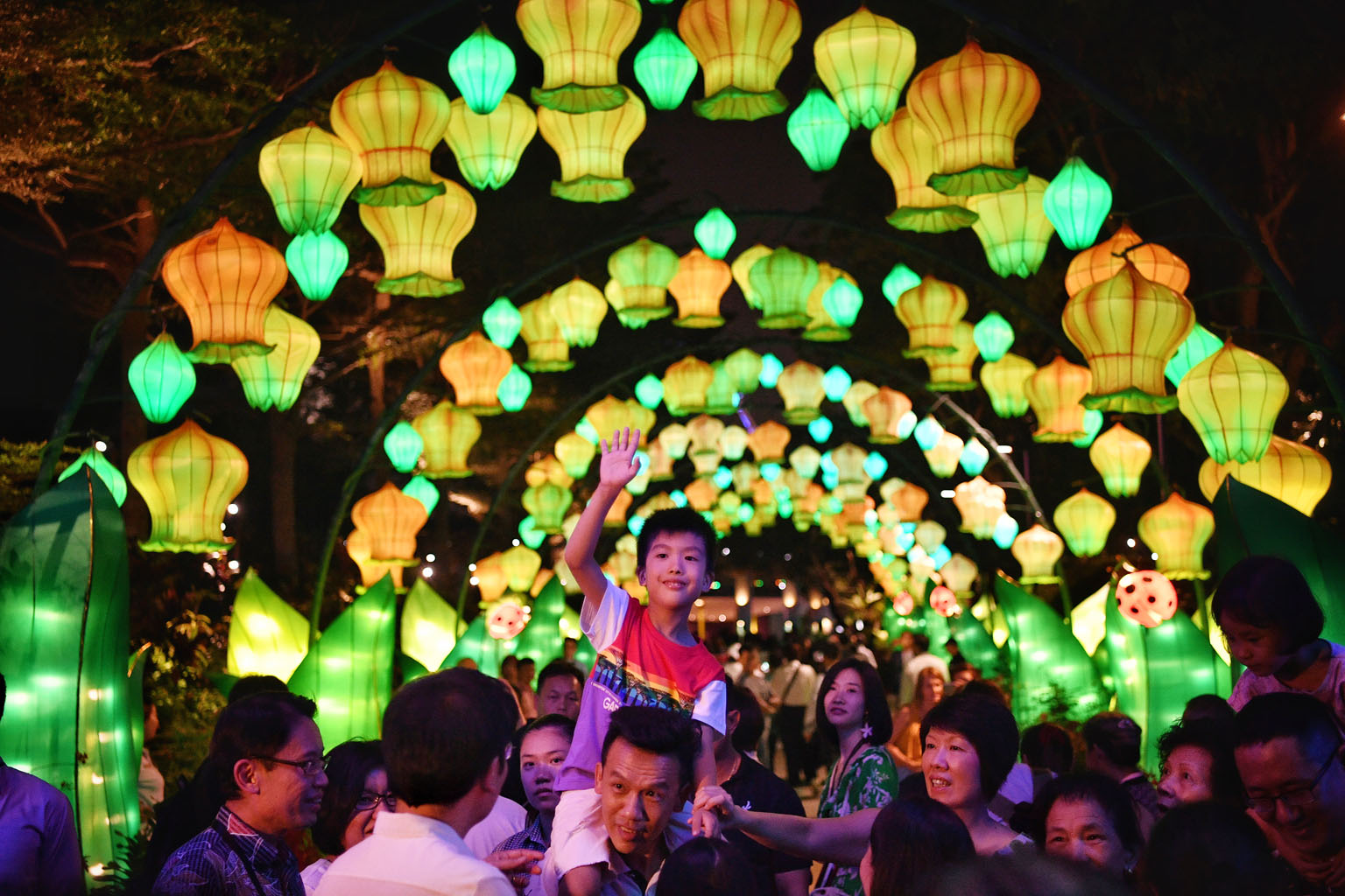 Visitors strolling under a dazzling lantern display entitled Jade Rabbit And The Moon at the official launch of the Mid-Autumn Festival at Gardens by the Bay last night. Mr Lawrence Wong, Minister for National Development and Second Minister for Fina