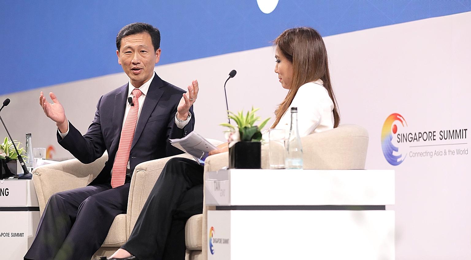 Education Minister Ong Ye Kung with moderator Tan Su Shan, managing director and group head of consumer banking and wealth management at DBS Bank, at a dialogue at the Singapore Summit at Shangri-La Hotel yesterday.
