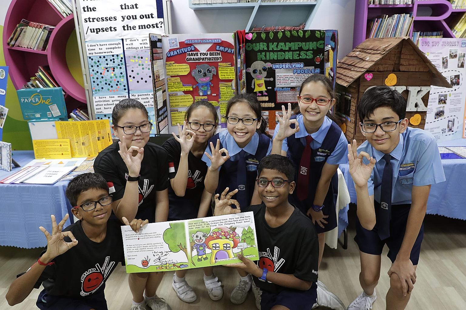 Pupils at Chongzheng Primary posing with an illustrated storybook that they put together under the school's Values in Action programme. The book aims to teach readers the importance of seeing things from others' perspectives, and of showing gratitude