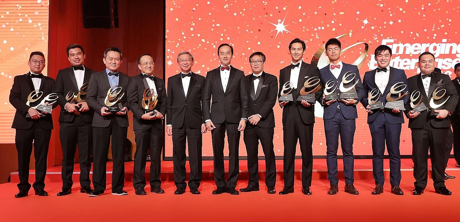 At the Emerging Enterprise Award event last night were (from left) Big Tiny co-founder Adrian Chia, Mighty Jaxx founder Jackson Aw, Whizpace founder and CEO Oh Ser Wah, EndoMaster CEO Goh Seow Ping, OCBC head of global commercial banking Linus Goh, S