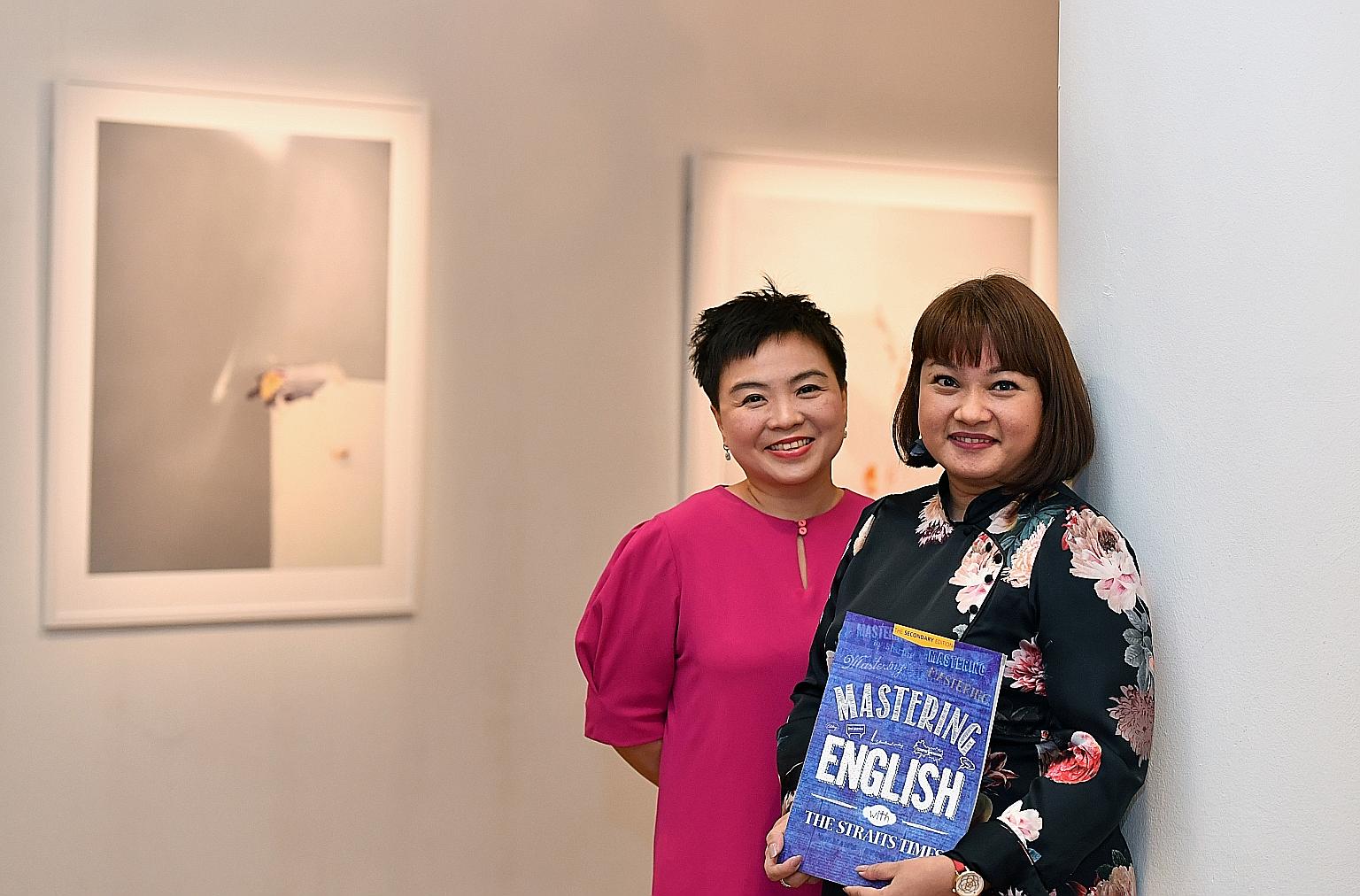 Straits Times Press general manager Susan Long (far left) and The Straits Times Schools team's Debra Ann Francisco with the workbook, Mastering English With The Straits Times: The Secondary Edition, which won Best Education Title.