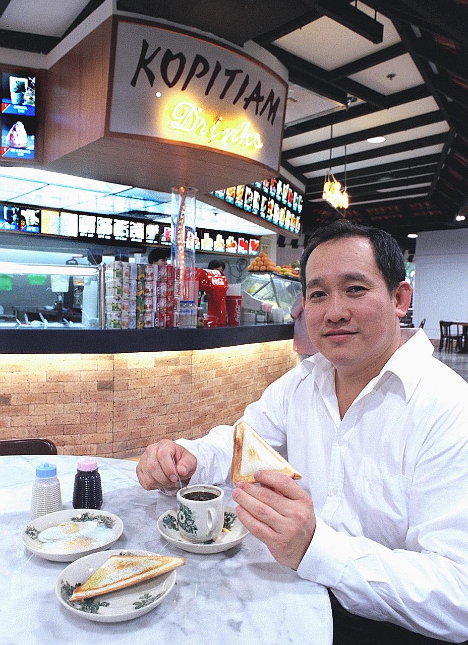 Mr Lim Bee Huat, seen here in an old file photo, started working as a coffee boy when he was nine. Today, his Kopitiam Investment has foodcourts, coffee shops and hawker centres islandwide, including flagship outlet Lau Pa Sat.