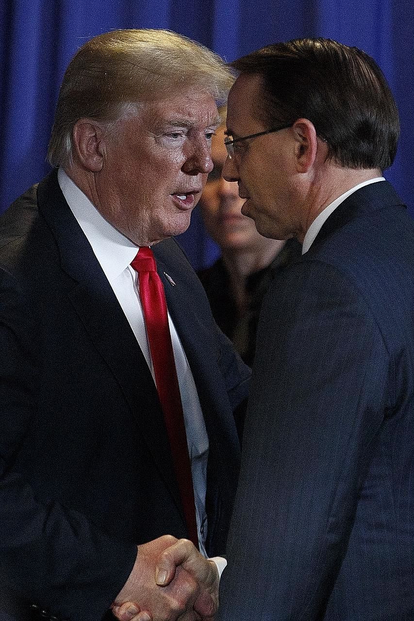President Donald Trump with Deputy US Attorney-General Rod Rosenstein. The revelations prompted speculation that Mr Trump might fire Mr Rosenstein, who oversees special counsel Robert Mueller's investigation.
