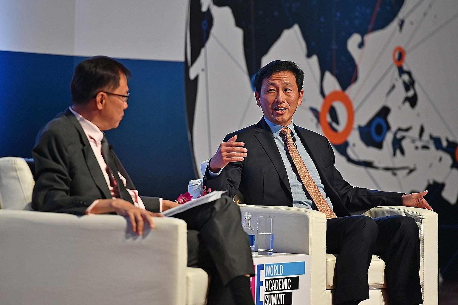 Global rankings need to go beyond just publications and citations, said Education Minister Ong Ye Kung, seen here with Professor Ho Teck Hua, who chaired a dialogue session at an education summit at NUS yesterday.