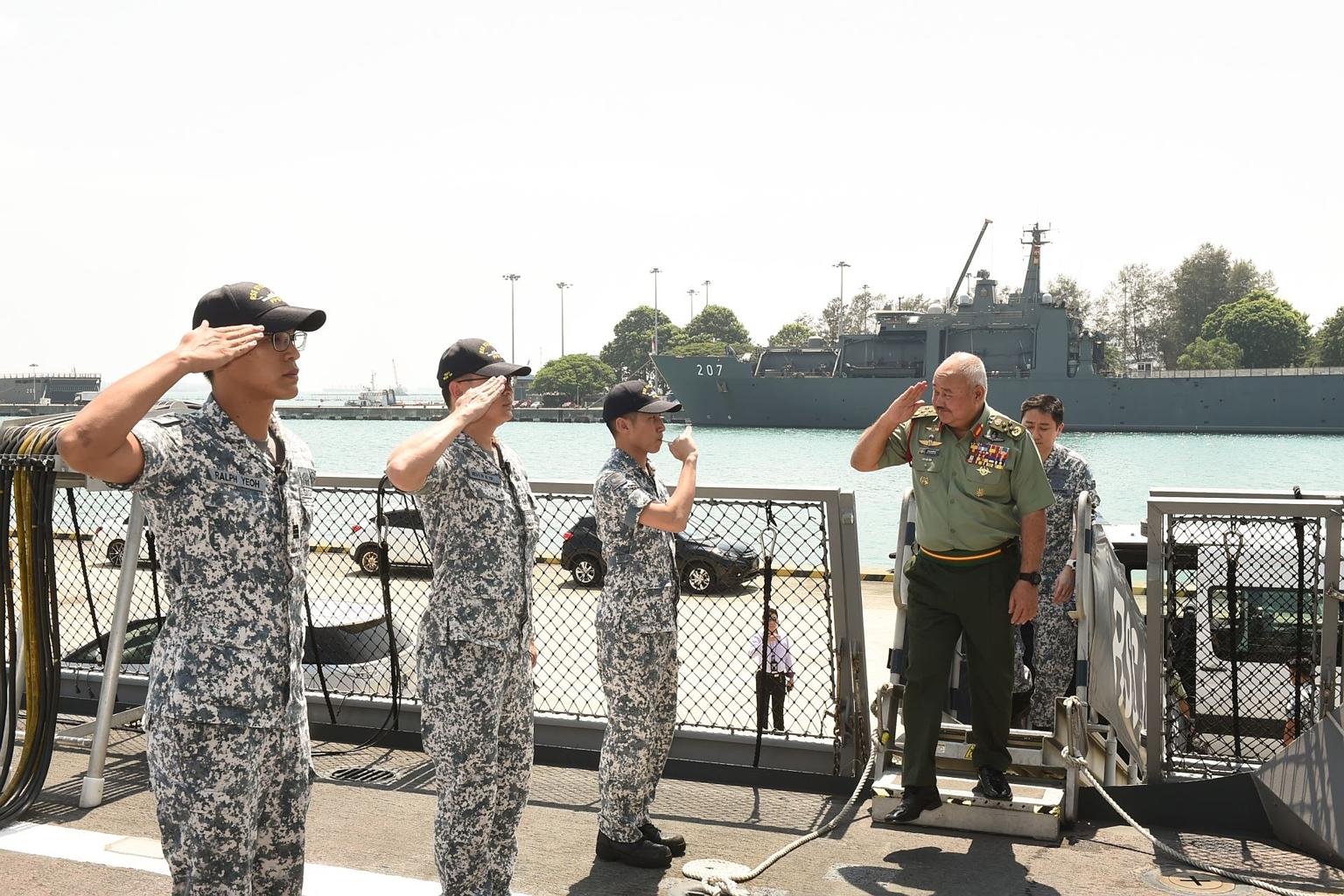 General Tan Sri Zulkifli Zainal Abidin boarding the RSS Steadfast during his visit to Changi Naval Base on Tuesday.