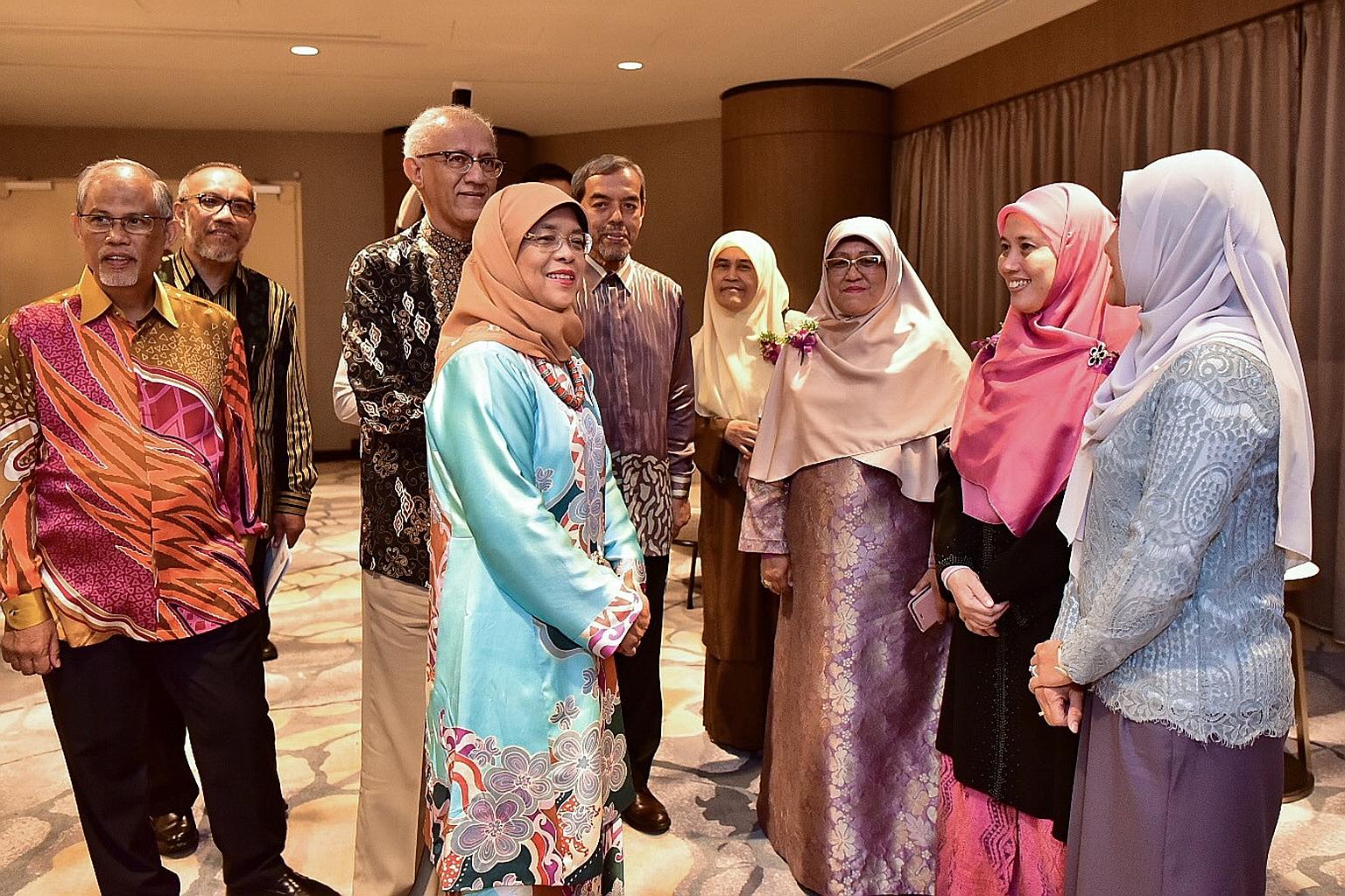 (From left) Minister-in-charge of Muslim Affairs Masagos Zulkifli, Muis deputy chief executive Albakri Ahmad, President Halimah Yacob's husband Mohamed Abdullah Alhabshee, Madam Halimah and Muis chief executive Abdul Razak Maricar, with award recipie