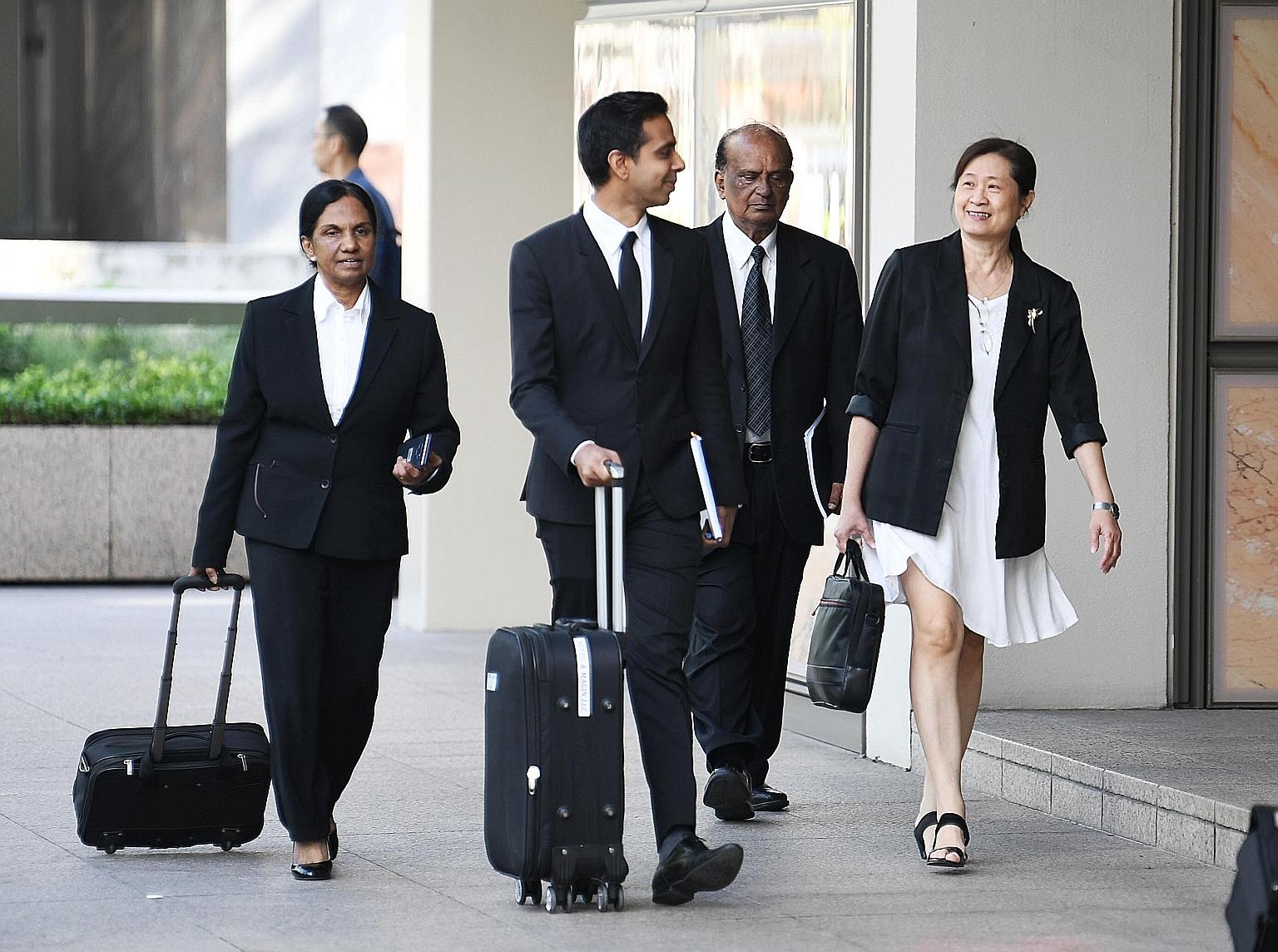 (From right) FMSS' Ms How Weng Fan with her lawyer Leslie Netto and legal team at the Supreme Court yesterday. On day five of a multimillion-dollar civil suit to recover alleged excess payments to FMSS, Mr Netto insisted that AHTC's town councillors