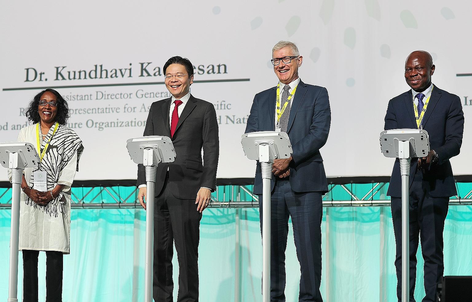 (From left) United Nations' Food and Agriculture Organisation assistant director-general Kundhavi Kadiresan, Minister for National Development Lawrence Wong, International Rice Research Institute director-general Matthew Morell and International Fund
