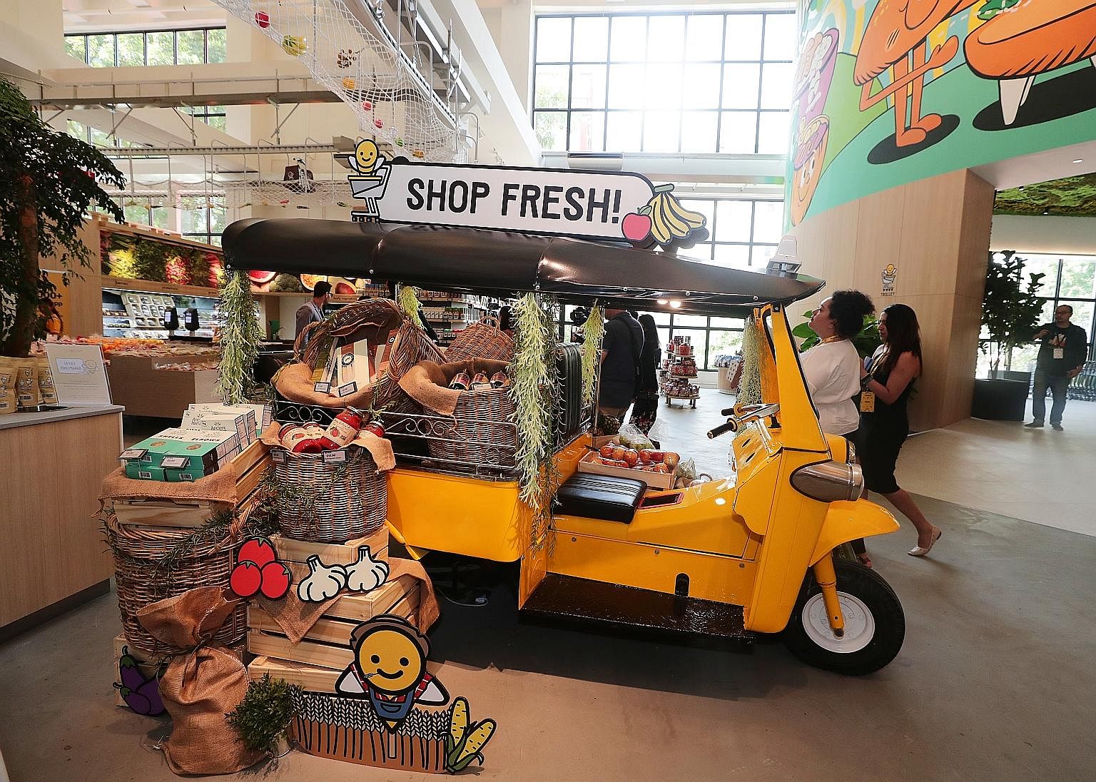 Customers buying 10 or fewer items at the supermarket can use their smartphone to scan each item and pay using the Honestbee app. There will be more than 20,000 products, including fresh produce, seafood and meat on sale when the new Habitat by Hones