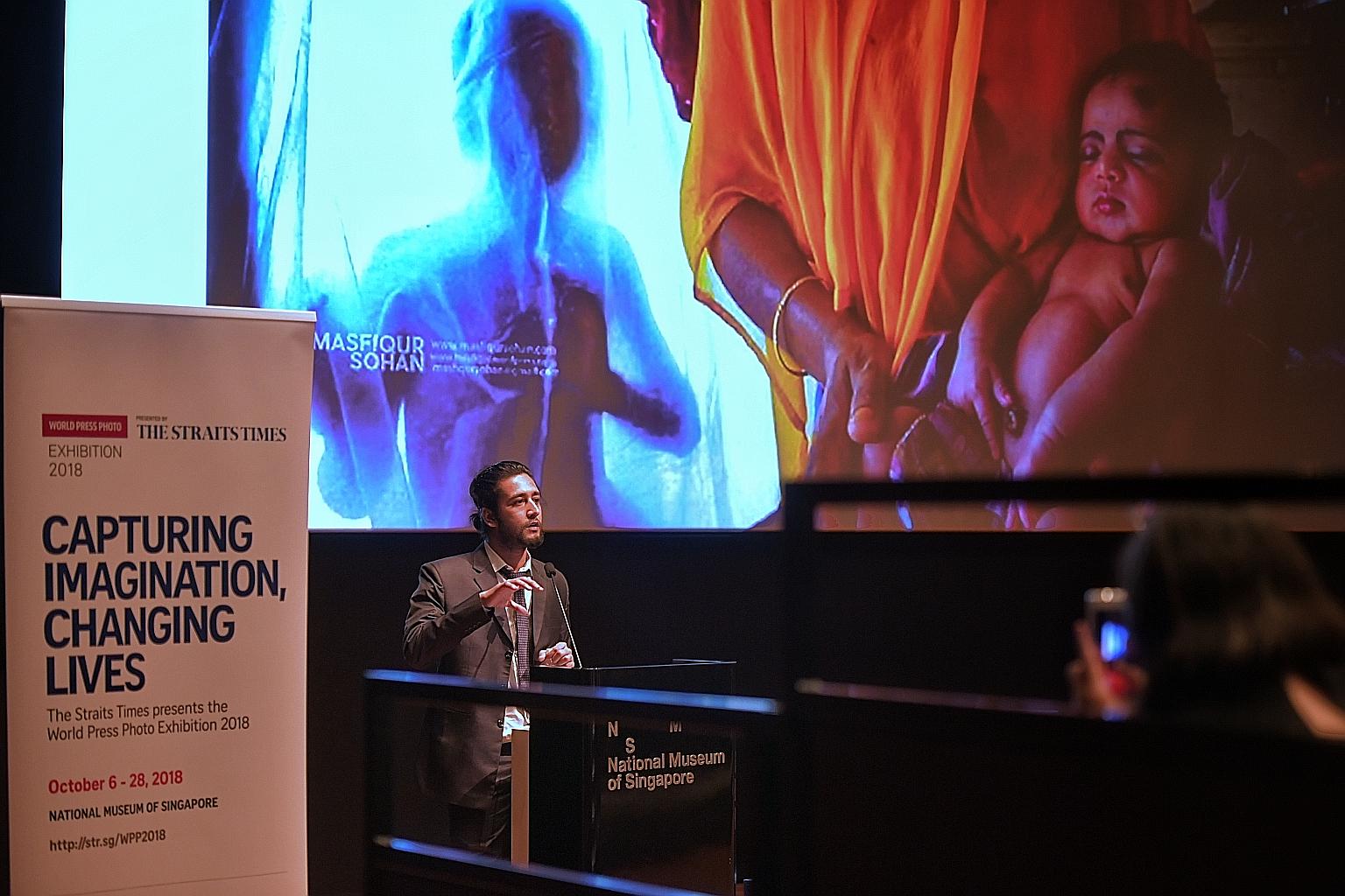 Award-winning Bangladeshi photojournalist Masfiqur Sohan talking yesterday about documenting the lives of people in Bangladesh, where he is based, at the World Press Photo Exhibition presented by The Straits Times. His talk and another by Australian