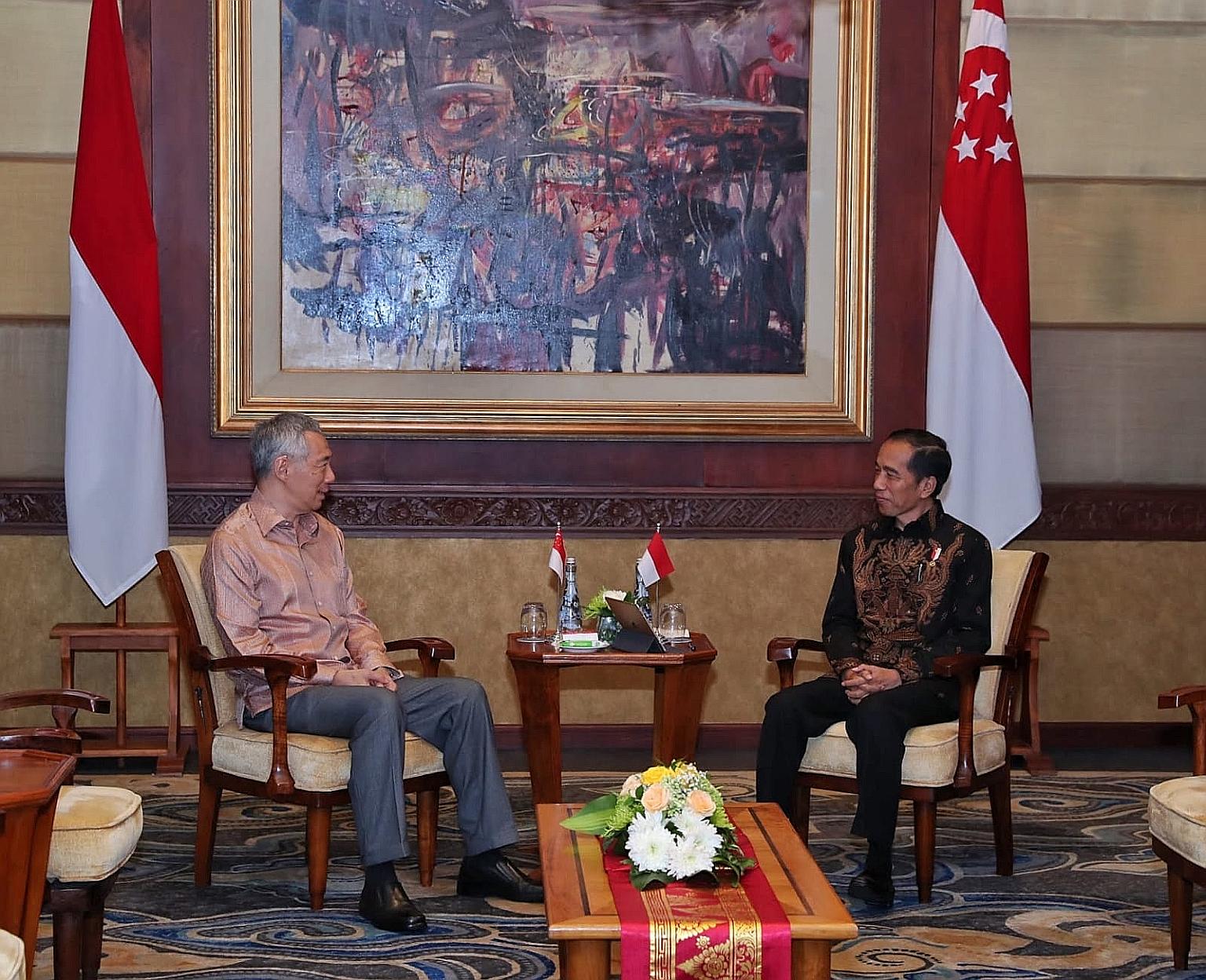 Prime Minister Lee Hsien Loong meeting Indonesian President Joko Widodo at a retreat in Bali earlier this month.