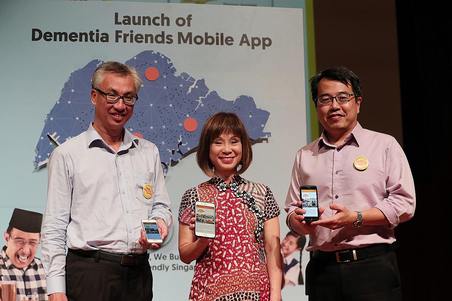 Senior Minister of State for Health Amy Khor with Tote Board senior director of corporate services Yong Fook Chyi (left) and Agency for Integrated Care deputy chief executive Tan Kwang Cheak during the launch of the Dementia Friends app yesterday. Th