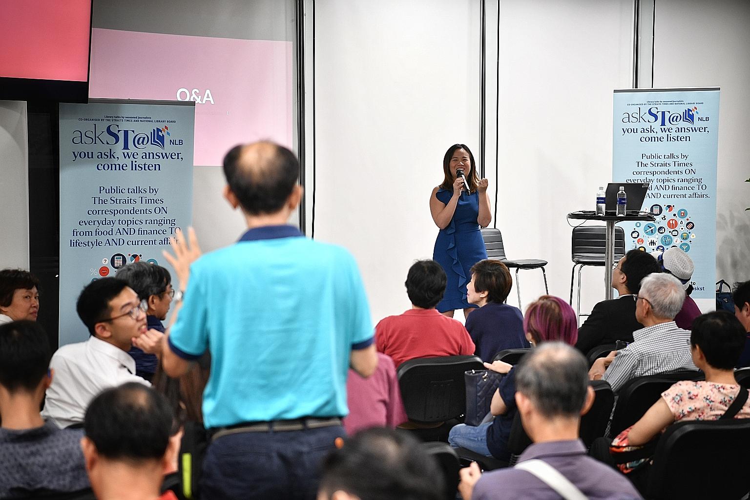Housing correspondent Rachel Au-Yong at yesterday's askST@NLB talk on buying one's first HDB home. She went through the different steps of buying a flat and touched on factors to consider, such as location, surrounding amenities and tenure of the uni