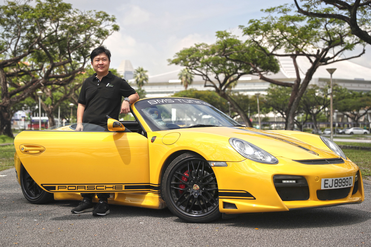 Mr Fed Wu, who runs Allmotoring, with a Porsche being sold on consignment. He said that out of the 30 cars he has in his showroom, 20 are on consignment. In the past, consignment cars made up only 20 per cent of his stock. The cars on consignment are